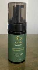 A bottle of 'Glas - Sharpe Hair' shampoo with a green label and a pump dispenser. The text on the label indicates that the product is for hair growth, nourishment, shine, and repair.