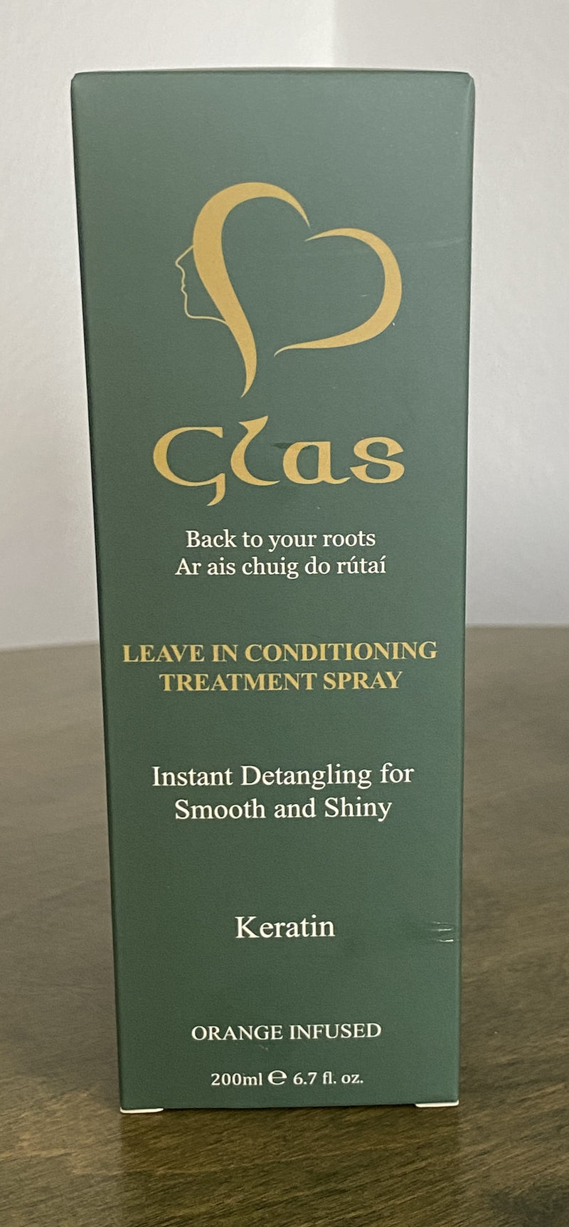 A bottle of Glas brand Leave in Conditioning Treatment Spray with the text 'Back to your roots. Instant Detangling for Smooth and Shiny Hair.